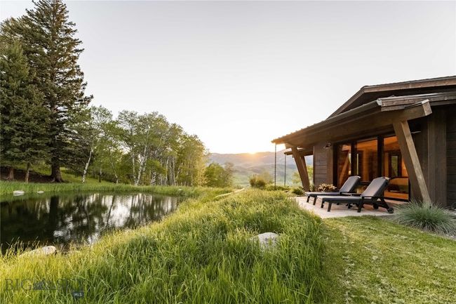 The Primary suite's private patio overlooks the pond. The perfect spot to watch for wildlife. | Image 54