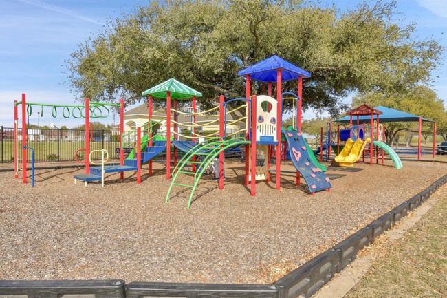 Community play area featuring fence | Image 26