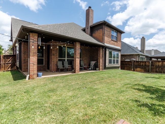 Another look at the patio space and back exterior. | Image 31