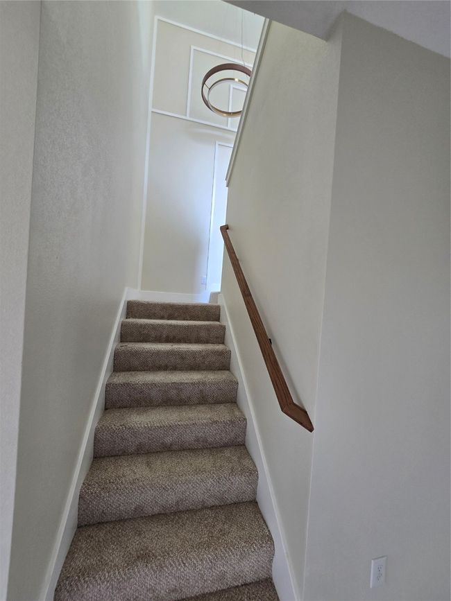 Stairway featuring carpet floors and baseboards | Image 17