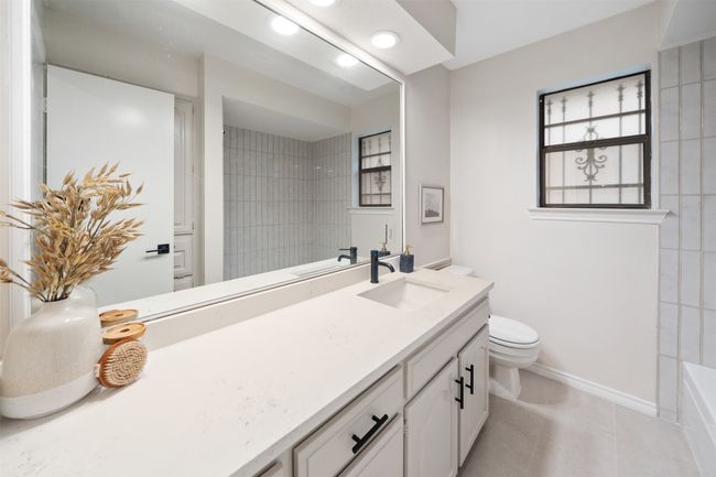 Full bath featuring vanity, toilet, tile floors, recessed lighting, and baseboards | Image 18
