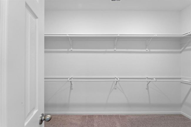 A view of your large primary walk-in Closet | Image 14