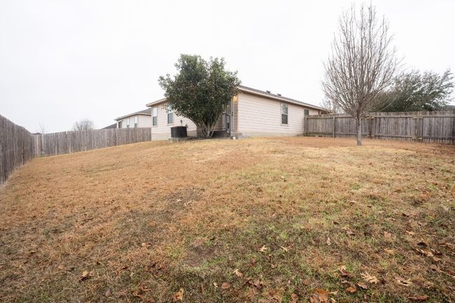 View of fenced backyard | Image 28