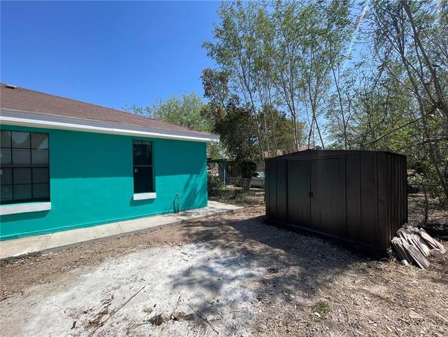 View of side of property featuring an outbuilding and a shed | Image 10