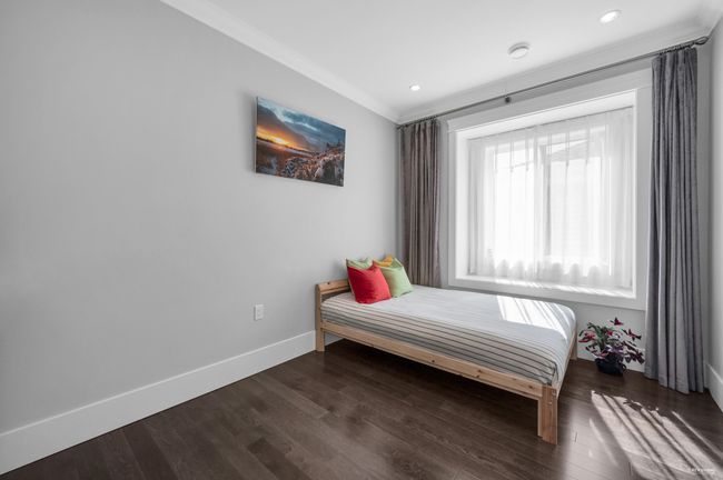 Bedroom featuring wood finished floors, crown molding, and recessed lighting | Image 28