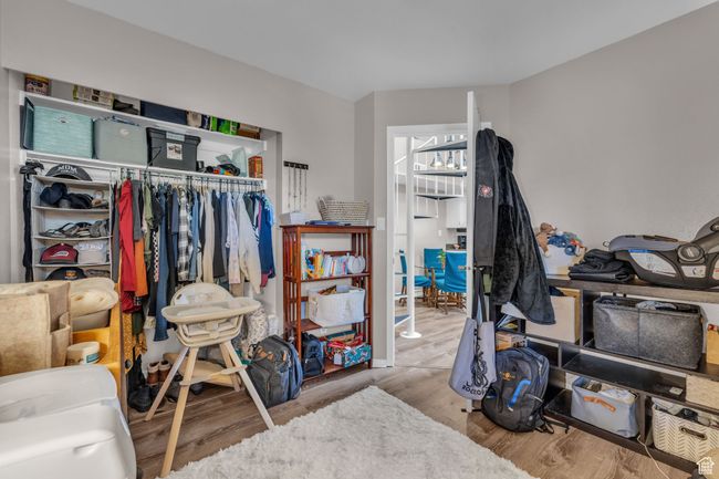 Interior space with a closet and wood finished floors | Image 13