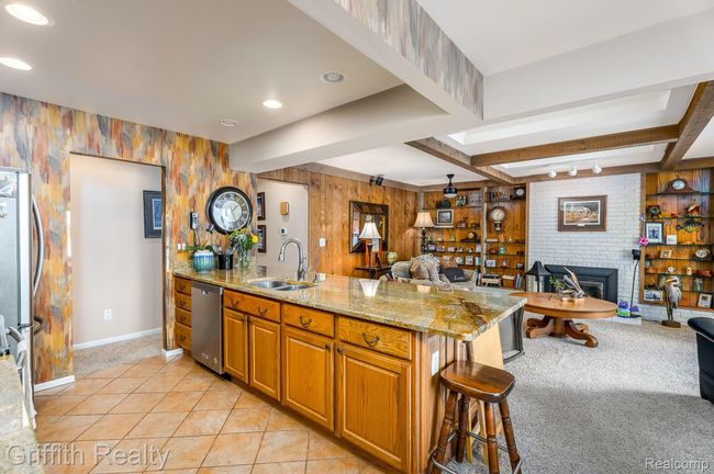kitchen opens to family room with fireplace | Image 18