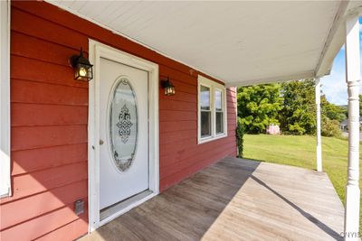 A beautiful front porch welcomes you... | Image 3