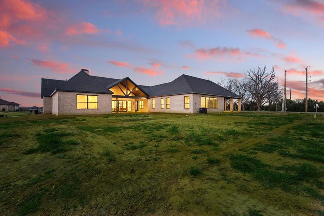 View of front of property with a lawn, a chimney, and brick siding | Image 40