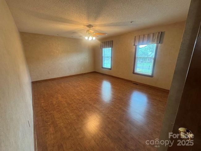 Spacious primary bedroom | Image 18