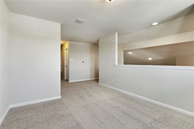 Spare room featuring carpet flooring, baseboards, and recessed lighting | Image 18