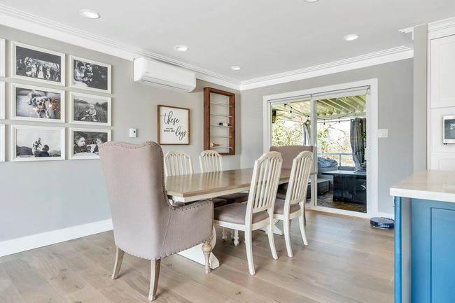 Dining space with crown molding, recessed lighting, a wall mounted AC, and light wood-type flooring | Image 35