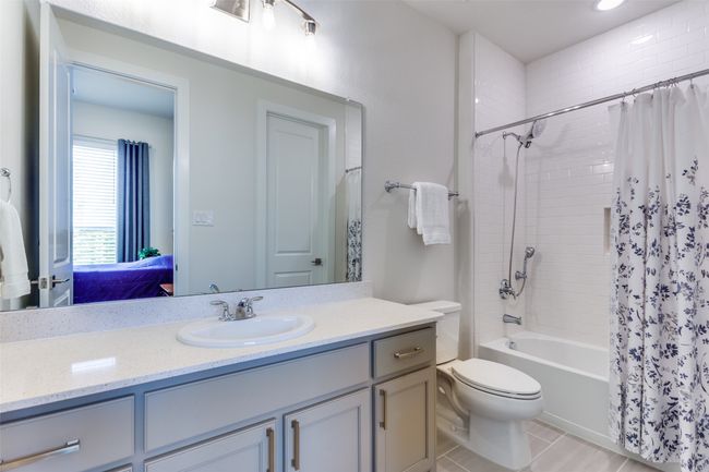 Ensuite bathroom featuring vanity and shower / bath combination with curtain | Image 9