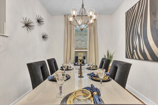 Nicely decorated, this dining room is ready for your celebrations. | Image 9