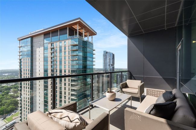 Balcony featuring a city view and an outdoor living space | Image 13