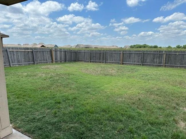 View of fenced backyard | Image 5
