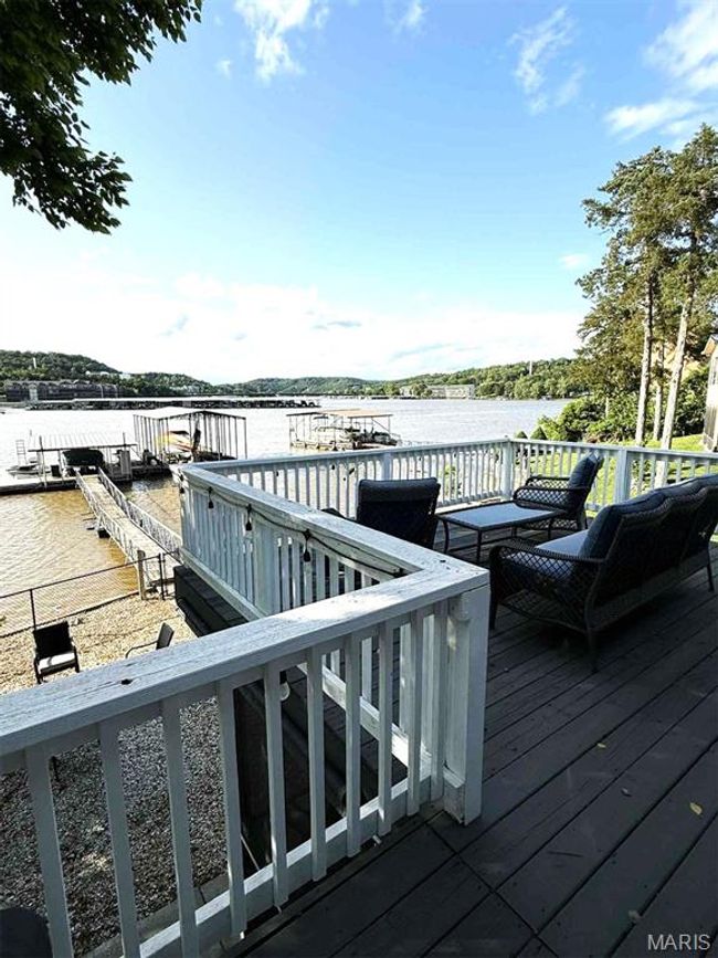 Deck featuring a water view | Image 30