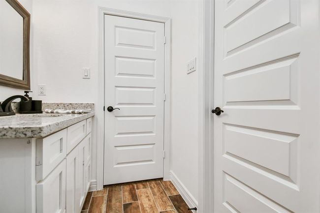 Hall Bath with door that opens to the second bedroom | Image 7