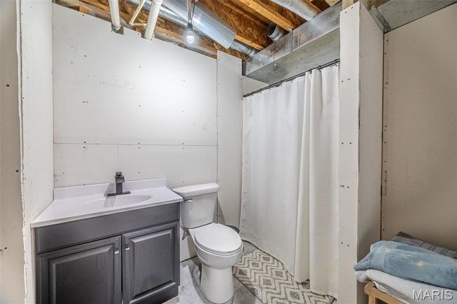 Bathroom with vanity and a shower with shower curtain | Image 51
