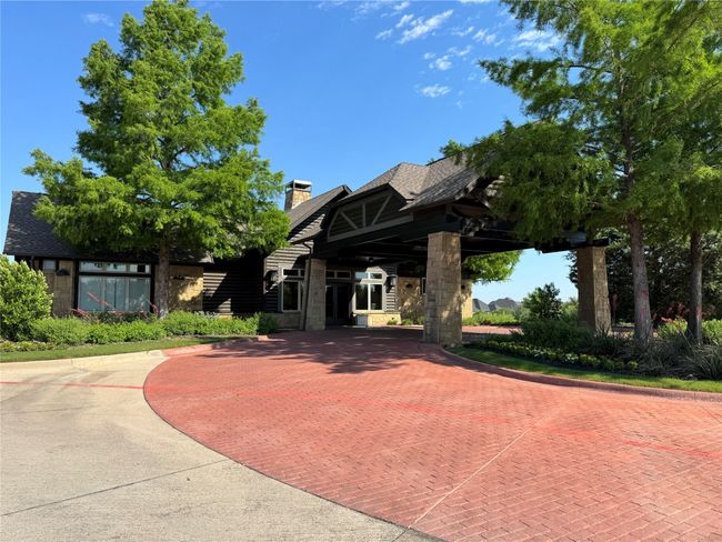 View of front of house featuring stone siding and a chimney | Image 38