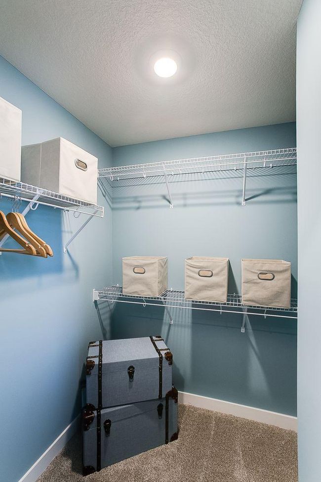 One of the spacious Finnegan primary bedroom walk-in closets. Photos of model home. Colors and options may vary. Ask Sales Agent for details. | Image 24