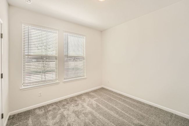 Carpeted empty room featuring baseboards | Image 12
