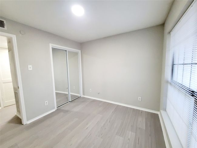 Unfurnished bedroom featuring a closet and light wood-type flooring | Image 18