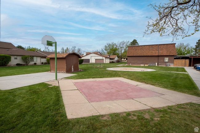 View of yard with a shed and an outbuilding | Image 21