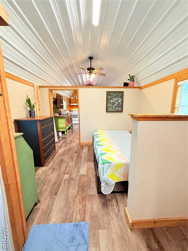 Bedroom with wood finished floors and baseboards | Image 20