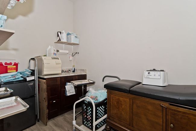 Office space featuring light wood-type flooring | Image 9