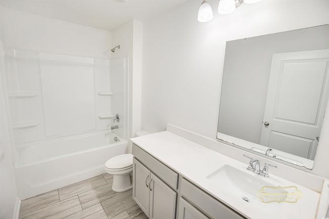 Full bathroom featuring vanity, toilet, and shower / bath combination | Image 30