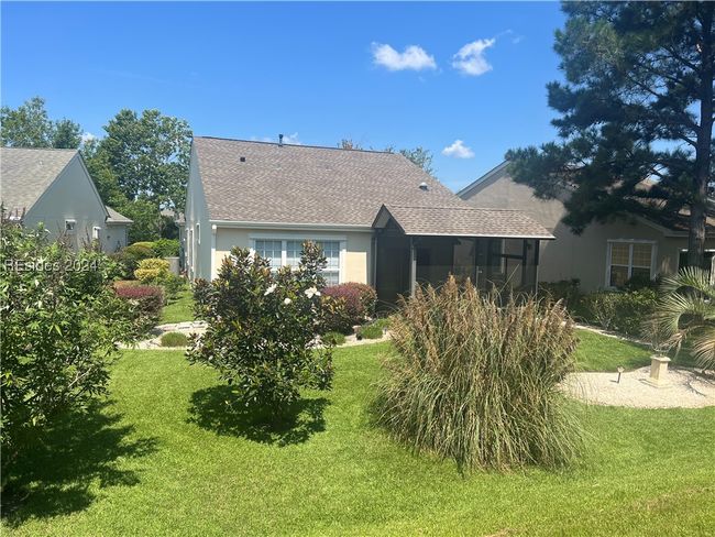 Rear view of property with a yard | Image 5
