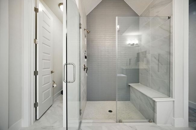 Bathroom featuring a shower stall and marble finish floors | Image 24