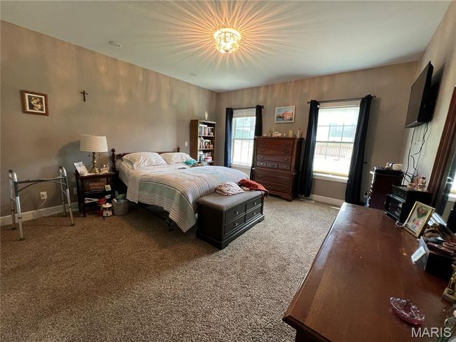 Bedroom with carpet and baseboards | Image 10