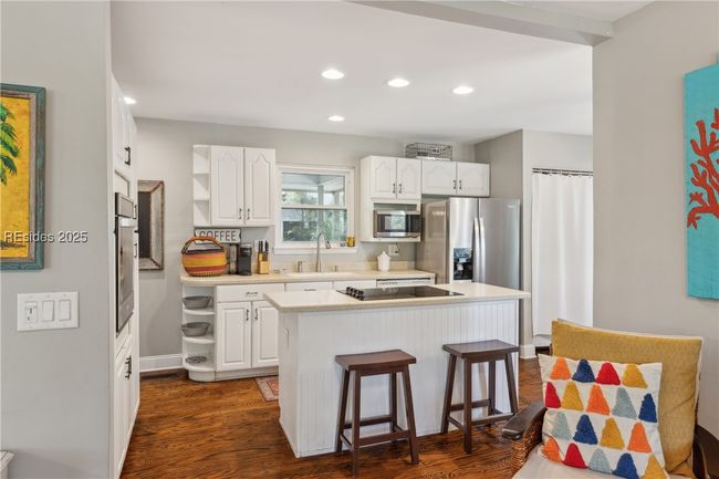 Updated chef's kitchen with stainless steel appliances & ample storage, efficient flow and a window over the sink for a view while prepping and cooking. | Image 20