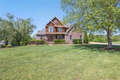 Beautiful three level brick, cedar & vinyl home on 1+ acre. | Image 1