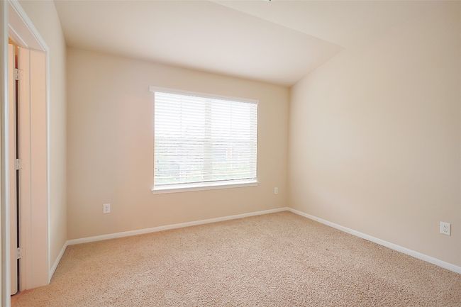 Carpeted spare room featuring baseboards | Image 14