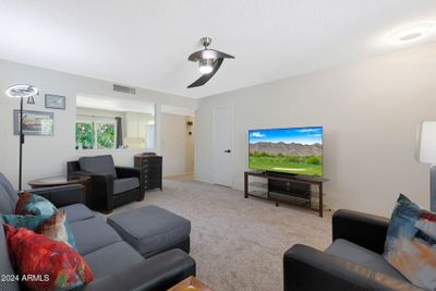 living room leads to dining area | Image 3