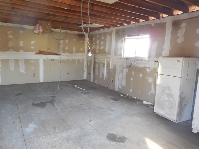 Below grade area featuring freestanding refrigerator | Image 7
