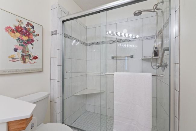 Newer walk in tiled shower in main level bathroom | Image 15