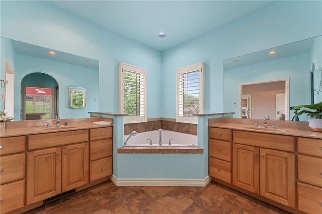 Bathroom with visible vents, two vanities, and a sink | Image 28