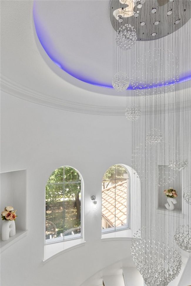 Detailed view of a chandelier and ornamental molding | Image 30