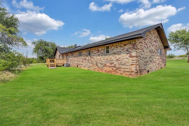 Back of property featuring a deck and a yard | Image 43