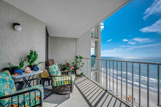 Balcony featuring view of water and beach | Image 17