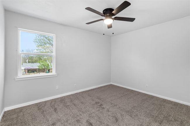 Spare room with ceiling fan, baseboards, and carpet flooring | Image 23