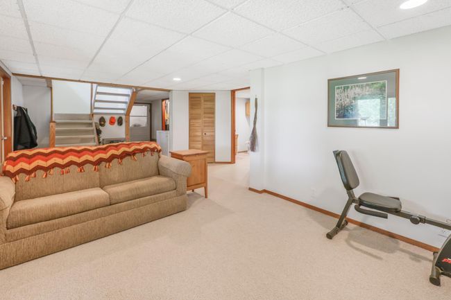 lower level family room with walk out door to yard | Image 16