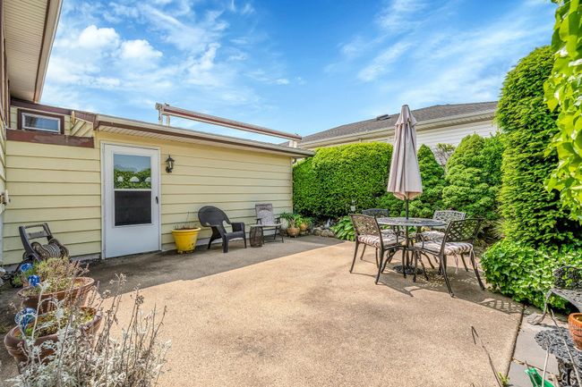 View of patio with outdoor dining area | Image 32
