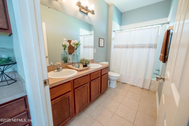 11760 Huckleberry Trl E, House other with 4 bedrooms, 2 bathrooms and null parking in MACCLENNY FL | Image 27