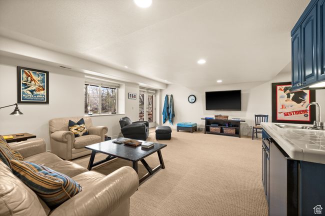 Living room featuring light carpet and recessed lighting | Image 23