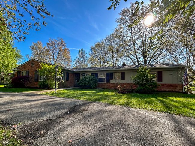 Large lot with mature trees and looped driveway | Image 4